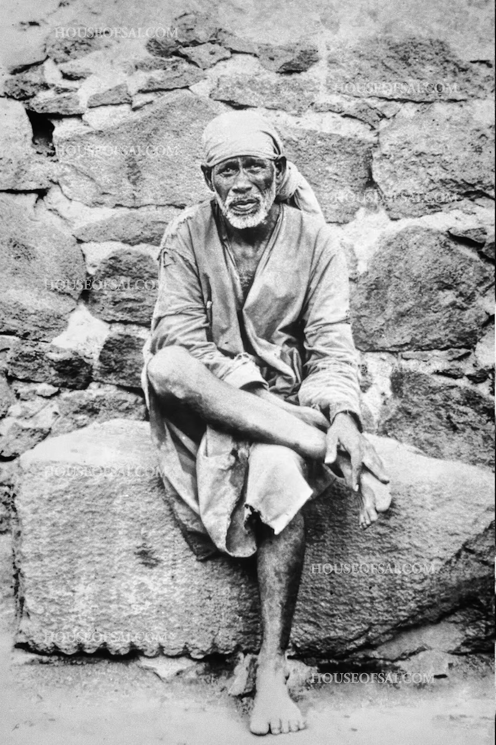 Sai Baba Sitting on Stone